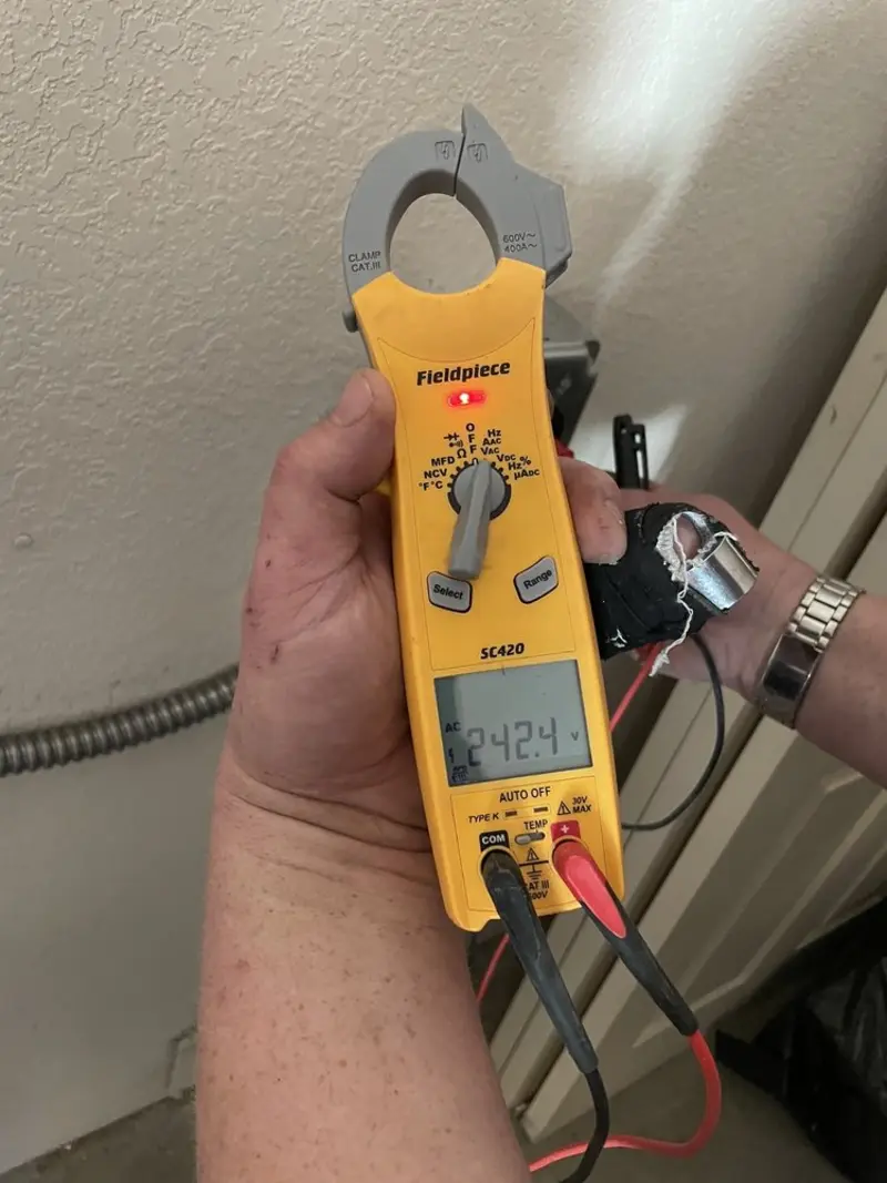 Voltage testing with clamp meter during Generator Installation in Milan